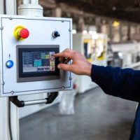 worker uses control panel factory e1754467342463